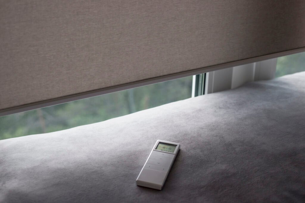 Remote control panel for motorized roller shades.